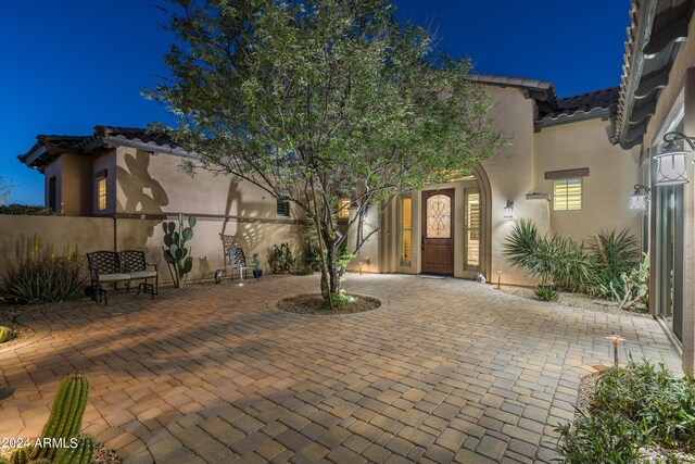 view of front facade with a patio