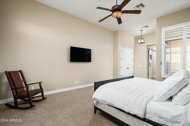 bedroom with ceiling fan and carpet