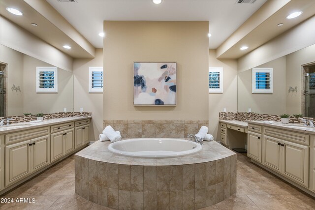 bathroom with vanity and separate shower and tub