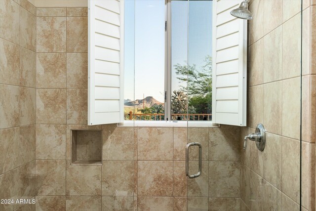 interior details featuring an enclosed shower