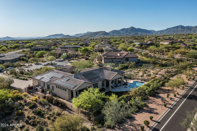 birds eye view of property featuring a mountain view