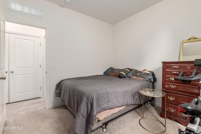 carpeted bedroom featuring baseboards