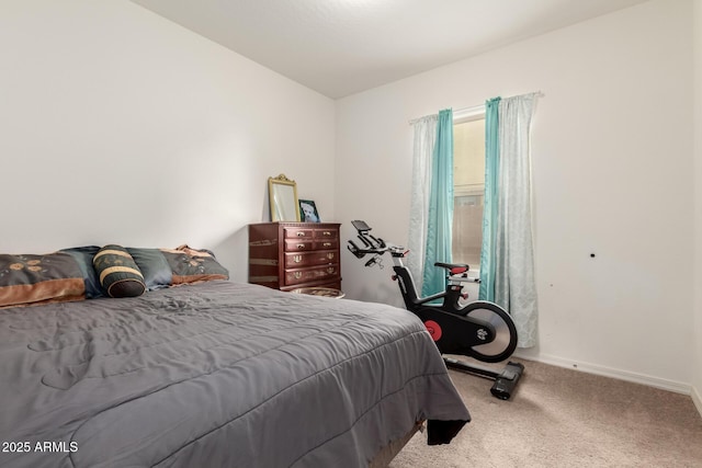 carpeted bedroom featuring baseboards