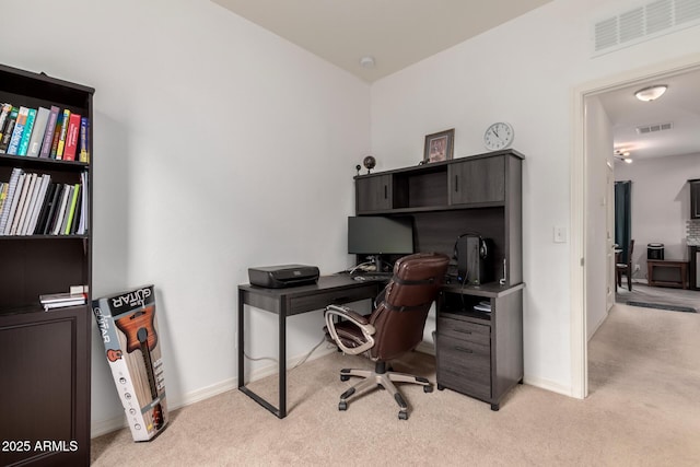 office space with carpet flooring, visible vents, and baseboards