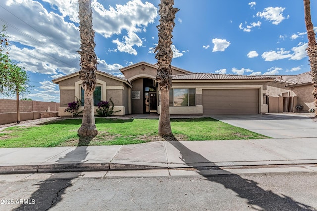 408 N Falcon Ct, Gilbert, AZ 85234 - mediterranean / spanish-style house featuring a garage, a front lawn, fence, stucco siding, and driveway
