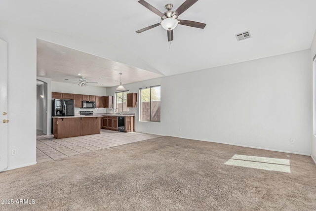 408 N Falcon Ct, Gilbert, AZ 85234 - unfurnished living room featuring visible vents, a ceiling fan, baseboards, and light carpet