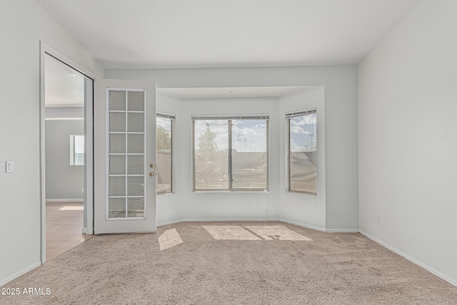 408 N Falcon Ct, Gilbert, AZ 85234 - carpeted spare room featuring baseboards and a wealth of natural light