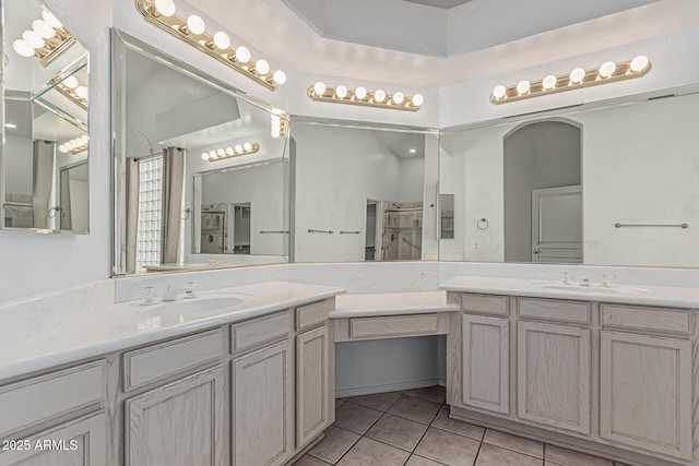 408 N Falcon Ct, Gilbert, AZ 85234 - bathroom featuring tile patterned floors, two vanities, and a sink
