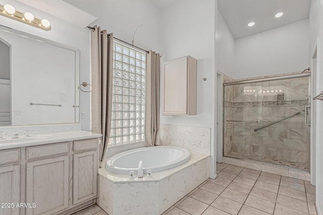 408 N Falcon Ct, Gilbert, AZ 85234 - full bathroom featuring tile patterned flooring, vanity, recessed lighting, a garden tub, and a stall shower