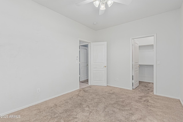 408 N Falcon Ct, Gilbert, AZ 85234 - unfurnished bedroom with a closet, a ceiling fan, baseboards, a spacious closet, and carpet flooring