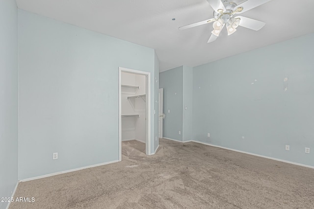 408 N Falcon Ct, Gilbert, AZ 85234 - unfurnished bedroom with ceiling fan, baseboards, a closet, a spacious closet, and carpet