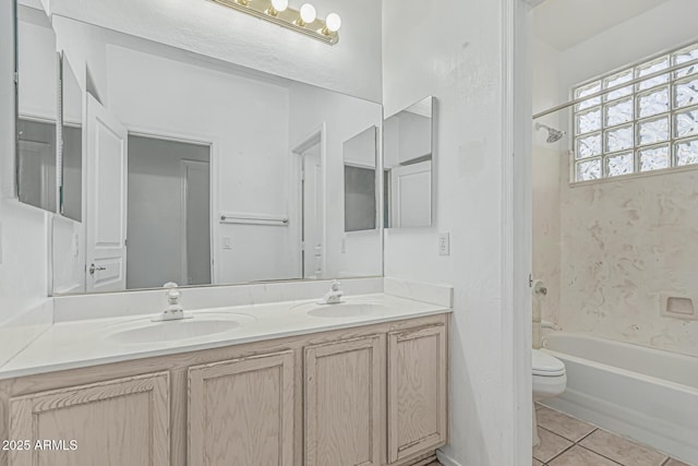 408 N Falcon Ct, Gilbert, AZ 85234 - bathroom featuring double vanity, toilet, bathing tub / shower combination, and a sink