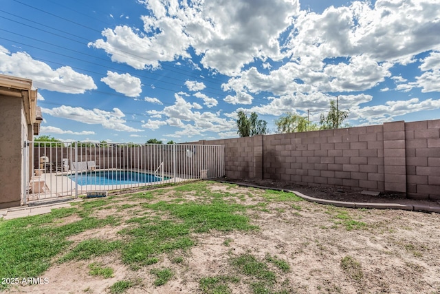 408 N Falcon Ct, Gilbert, AZ 85234 - view of yard featuring a fenced in pool and a fenced backyard