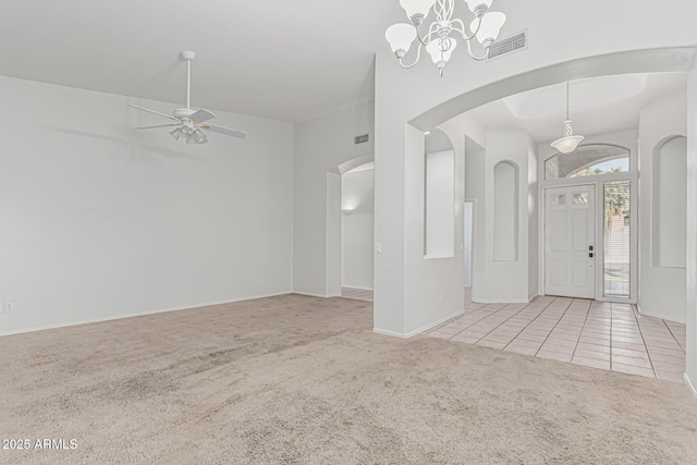 408 N Falcon Ct, Gilbert, AZ 85234 - carpeted foyer entrance with visible vents, arched walkways, and tile patterned flooring
