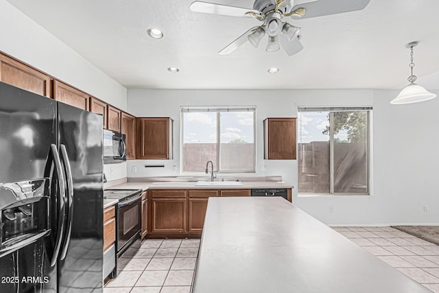 408 N Falcon Ct, Gilbert, AZ 85234 - kitchen featuring a sink, light countertops, black appliances, and light tile patterned flooring
