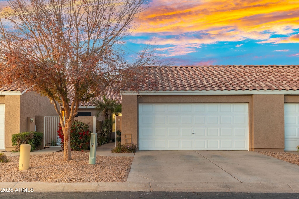 single story home with a garage