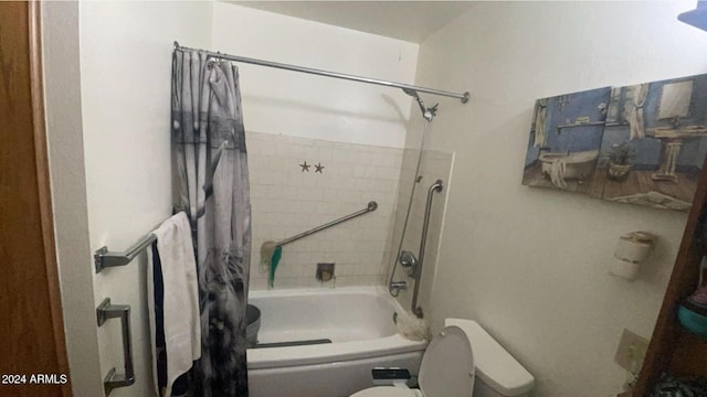 bathroom featuring toilet and shower / tub combo with curtain