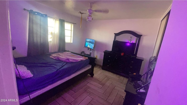 bedroom featuring parquet floors and ceiling fan