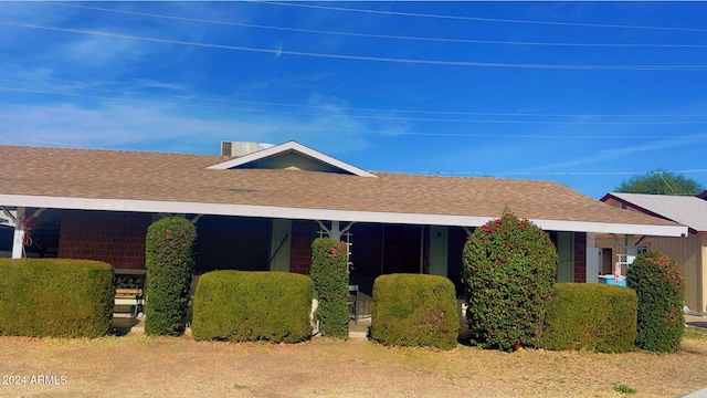 view of property exterior with covered porch