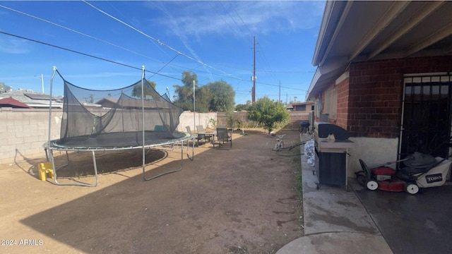 view of yard with a trampoline