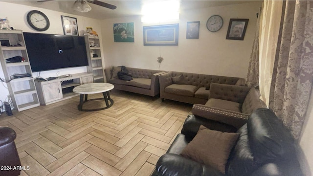 living room featuring ceiling fan and light parquet flooring