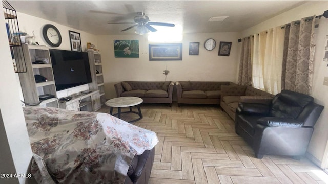 living room featuring ceiling fan and light parquet flooring