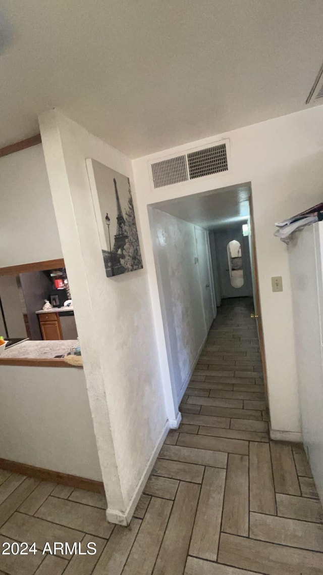 hallway featuring hardwood / wood-style flooring