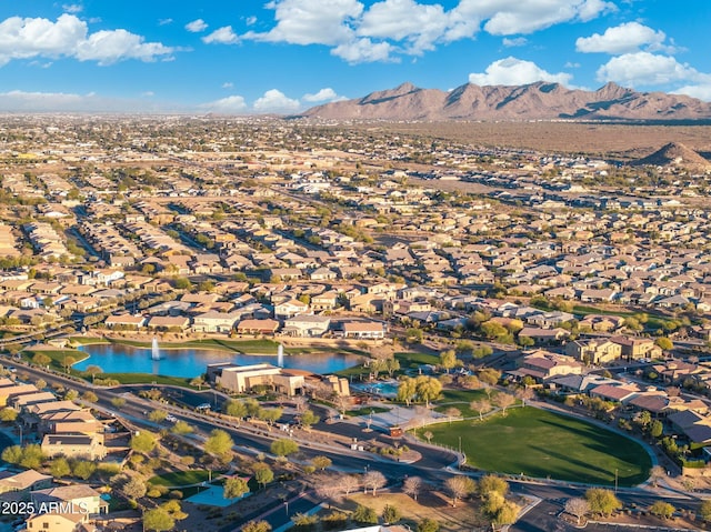 drone / aerial view with a residential view and a water and mountain view