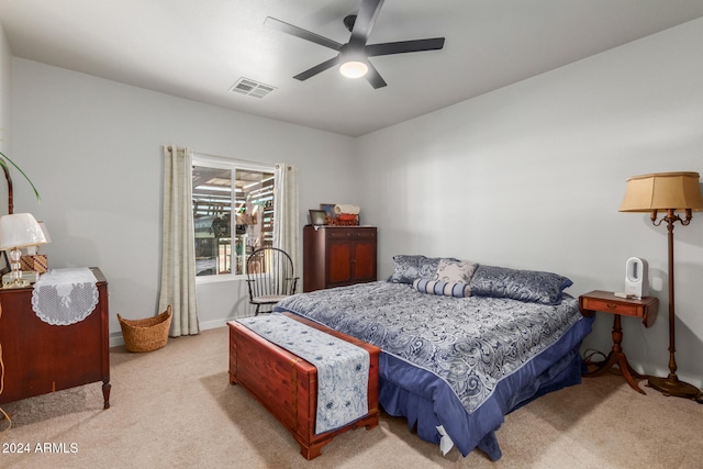 bedroom featuring ceiling fan and light carpet