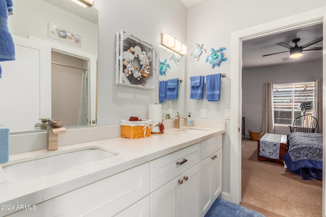 bathroom featuring ceiling fan and vanity