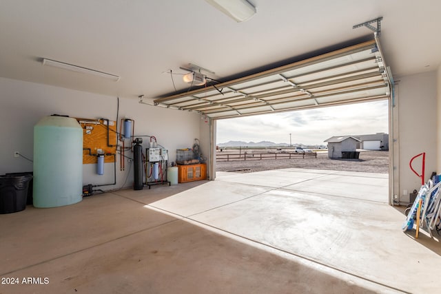 garage featuring a mountain view and a garage door opener