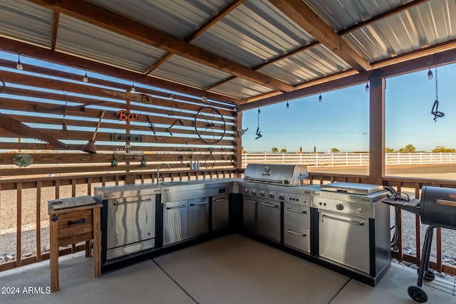 view of patio / terrace featuring a pergola, a grill, sink, and an outdoor kitchen