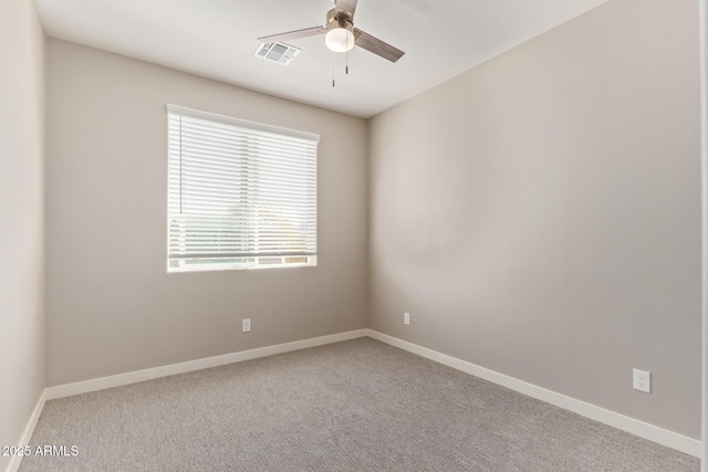 8026 S 6th Dr, Phoenix, AZ 85041 - carpeted spare room with visible vents, baseboards, and a ceiling fan