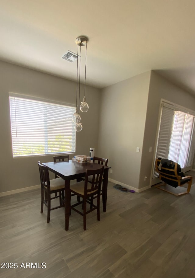 8026 S 6th Dr, Phoenix, AZ 85041 - dining room with visible vents, baseboards, and wood finished floors