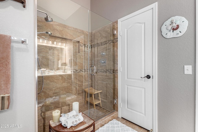 full bathroom featuring a shower stall