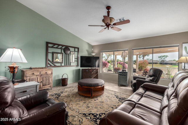 living room featuring a ceiling fan, lofted ceiling, and baseboards