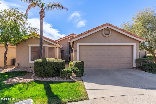 view of front of home with a garage and central air condition unit