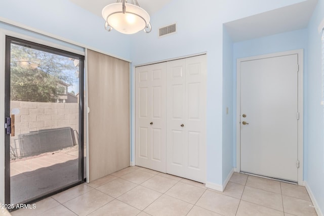 entryway with light tile patterned floors