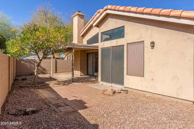 rear view of house featuring a patio area