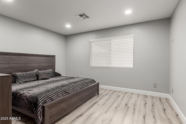 4741 N 85th Ave, Phoenix, AZ 85037 - bedroom featuring wood finished floors, recessed lighting, and baseboards