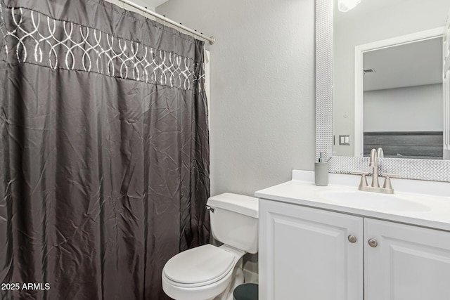 4741 N 85th Ave, Phoenix, AZ 85037 - bathroom featuring vanity, toilet, a textured wall, and a shower with curtain
