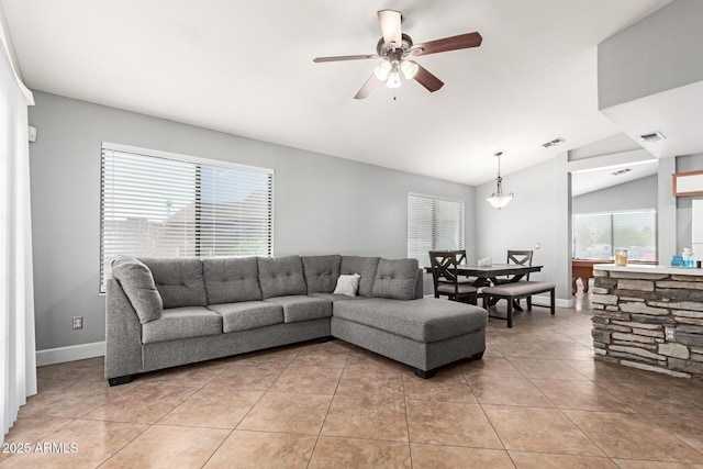 4741 N 85th Ave, Phoenix, AZ 85037 - living area with vaulted ceiling, a ceiling fan, light tile patterned floors, and baseboards