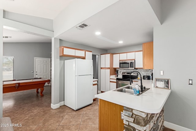 4741 N 85th Ave, Phoenix, AZ 85037 - kitchen with appliances with stainless steel finishes, a peninsula, pool table, baseboards, and recessed lighting