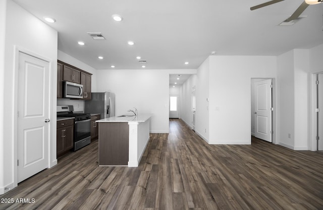24606 W St Catherine Ave, Buckeye, AZ 85326 - kitchen with visible vents, a sink, dark wood-style flooring, appliances with stainless steel finishes, and ceiling fan