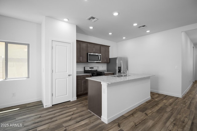 24606 W St Catherine Ave, Buckeye, AZ 85326 - kitchen with visible vents, appliances with stainless steel finishes, dark brown cabinetry, and a sink
