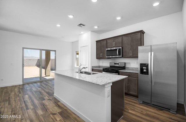 24606 W St Catherine Ave, Buckeye, AZ 85326 - kitchen featuring stainless steel appliances, a sink, dark wood-style flooring, visible vents, and dark brown cabinetry