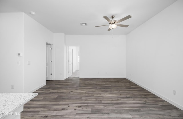 24606 W St Catherine Ave, Buckeye, AZ 85326 - empty room featuring ceiling fan, baseboards, wood finished floors, and visible vents