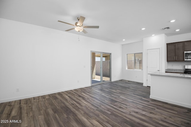 24606 W St Catherine Ave, Buckeye, AZ 85326 - unfurnished living room with dark wood finished floors, baseboards, visible vents, recessed lighting, and ceiling fan