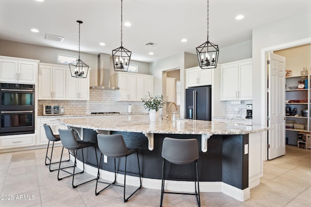 31320 N 54th Pl, Cave Creek, AZ 85331 - kitchen with black appliances, wall chimney range hood, backsplash, a sink, and a large island with sink