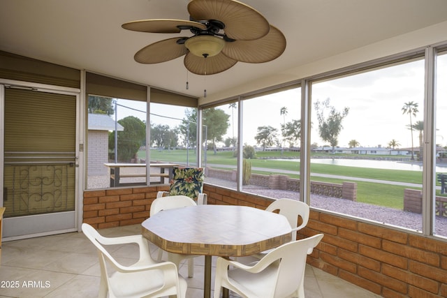 sunroom with a ceiling fan